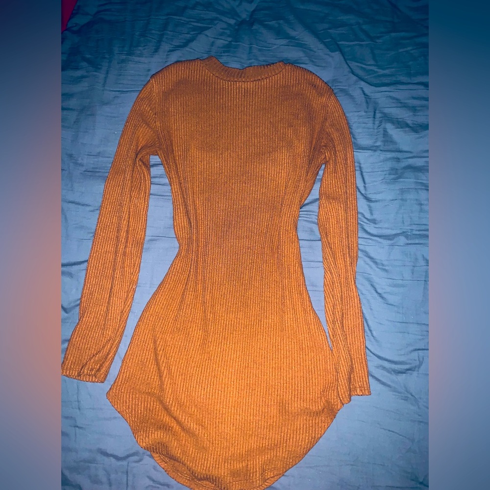 I am selling an orange thin vintage sweater I got while thrifting.